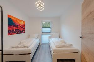 Ένα ή περισσότερα κρεβάτια σε δωμάτιο στο BPS Apartment #9 Business - NEU - Deluxe - Modern