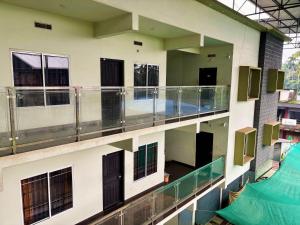an overhead view of a building with a swimming pool at Saraa Homes Fully Furnished 2BHK Apartment in Kulattūr