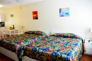Postel nebo postele na pokoji v ubytování Ocean Drive Villas