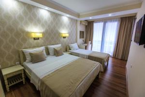 Ένα ή περισσότερα κρεβάτια σε δωμάτιο στο Sirena Marta