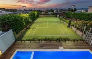 an image of a tennis court on a house at Luxury Pool Sauna Spa Tennis Court in Mount Martha +27 photos