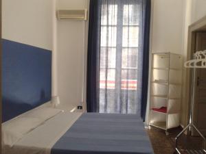 Posteľ alebo postele v izbe v ubytovaní B&B CARAVAGGIO SIRACUSA 200 Metres from Ortigia