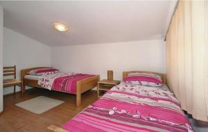 Postel nebo postele na pokoji v ubytování Apartments Vesna