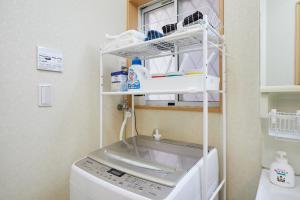 東京にあるUU Houseの洗濯機(棚付) +21枚の写真