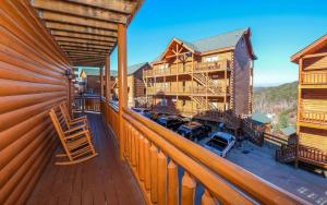an image of a balcony of a log cabin at Splash N Mountain Lookout in Pigeon Forge