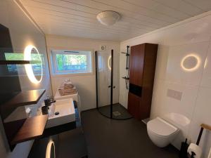 a bathroom with a toilet and a sink at The simple appartment in Stryn in Stryn