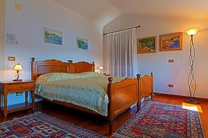 Ein Bett oder Betten in einem Zimmer der Unterkunft Villa Tuttorotto