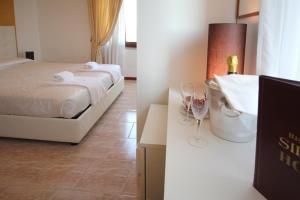 Postel nebo postele na pokoji v ubytování Hotel Sirena