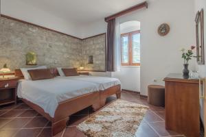 A bed or beds in a room at Apartments Babilon