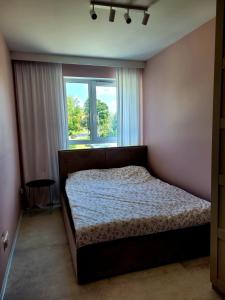 Postel nebo postele na pokoji v ubytování Jeziorna213