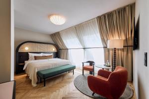 Postel nebo postele na pokoji v ubytování Hotel Palais Mailberger Hof