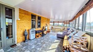 a living room with a couch and a table at Sun Penthouse in Flic-en-Flac