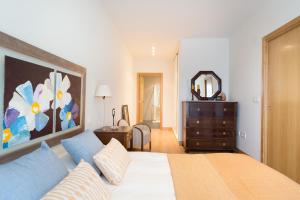 Posteľ alebo postele v izbe v ubytovaní San Roque Center - IB. Apartments