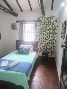 Postel nebo postele na pokoji v ubytování Habitación Muisca