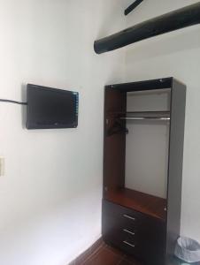 TV a/nebo společenská místnost v ubytování Habitación Muisca