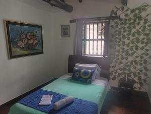 Postel nebo postele na pokoji v ubytování Habitación Muisca