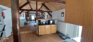 a room with a kitchen and a living room at Mühlbachhof in Berg