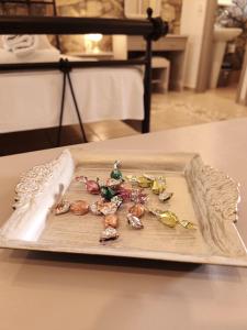 a tray filled with shells on top of a table at Vila 650 sqm, with Private Pool, 10 bedrooms with ensuite bathrooms & kitchen to each room - Elia Village by Irida Iris Group in Plomarion