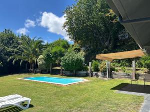 a swimming pool in the yard of a house at Casa Libao in Arrieta