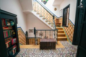 a staircase with a chest in the middle of a room at Dar Rania in Tangier
