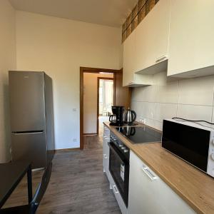 a kitchen with a refrigerator and a counter top at WDI - WokersDream in Krefeld