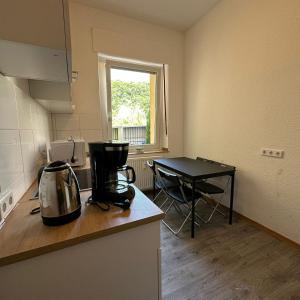 a kitchen with a coffee maker on a counter at WDI - WokersDream in Krefeld +4 photos