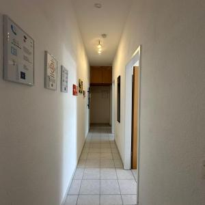 an empty hallway with a hallway leading to a room at WDI - WorkersDream 2 in Krefeld