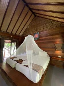 Ένα ή περισσότερα κρεβάτια σε δωμάτιο στο The Cliff and River Jungle Resort ภูผาและลำธารรีสอร์ท +135 φωτογραφίες