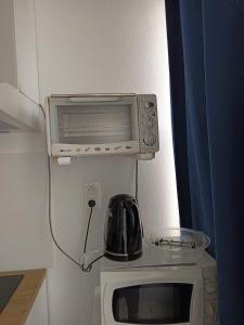 Kuchyň nebo kuchyňský kout v ubytování Studio "Je me pose" - centre ville historique