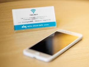 a cell phone sitting on a table next to a card at HOTEL DREAM GATE maihama - Main & Annex in Urayasu +57 photos