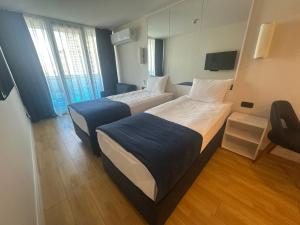 Postel nebo postele na pokoji v ubytování Orbi City Hotel Official D Block