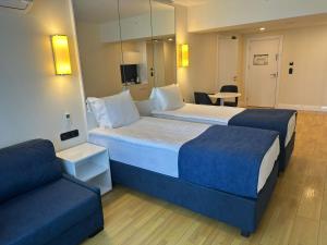 Postel nebo postele na pokoji v ubytování Orbi City Hotel Official D Block