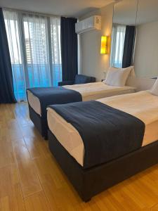 Postel nebo postele na pokoji v ubytování Orbi City Hotel Official D Block