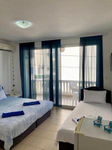 Postel nebo postele na pokoji v ubytování DK Apartmani