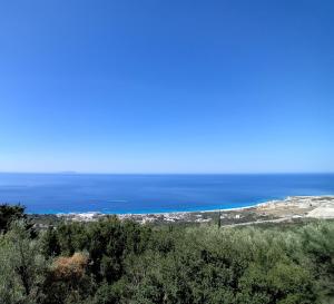 a view of the ocean from the top of a hill at Mimi's Apartments, Palasë in Palasë +1 photo