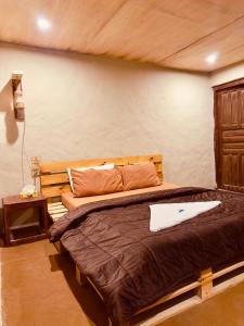 Postel nebo postele na pokoji v ubytování Orgventure Resorts Skardu