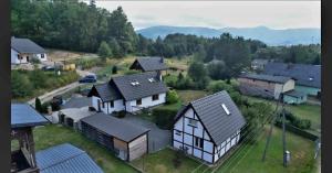 an aerial view of a house in a village at DOMEK CHATKA BUKOWIANKA w Bukowcu koło Karpacza in Bukowiec
