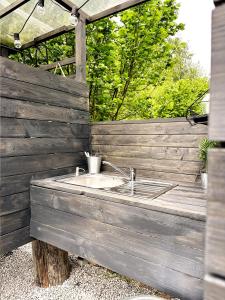 a bathroom with a sink on a wooden wall at Rest Place Mszczonów in Mszczonów +222 photos
