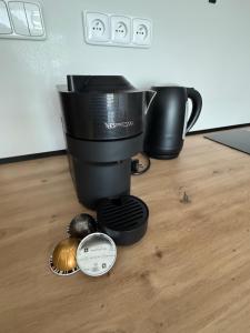 a coffee maker sitting on a table with a coffee pot at Apartmán Vločka Tatranská Lomnica in Tatranská Lomnica