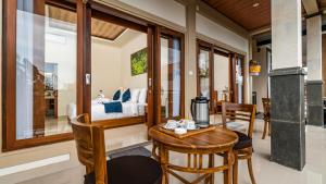 a room with a table with a coffee maker on it at Usana House Ubud in Ubud +37 photos