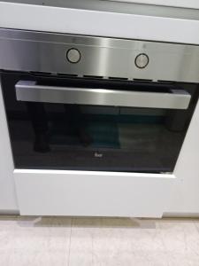 a microwave oven sitting inside of a kitchen at Vortex Suites KLCC by Comfy Stay in Kuala Lumpur