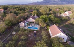 an aerial view of a house with a swimming pool at House Marin in Drniš