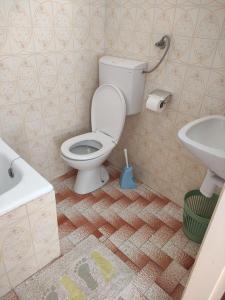 a bathroom with a toilet and a sink at Apartments Poldan in Supetarska Draga +21 photos