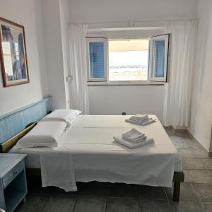 Posteľ alebo postele v izbe v ubytovaní Vel Marì - Rooms on the Beach