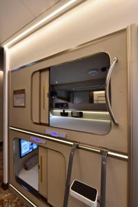 a mirror on the side of a train at Bahrain Airport Hotel Airside Hotel for Transiting and Departing Passengers only in Muharraq
