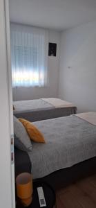 Ένα ή περισσότερα κρεβάτια σε δωμάτιο στο MB House +8 φωτογραφίες