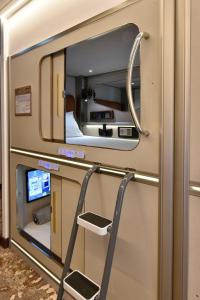 a view of a train room with a mirror at Bahrain Airport Hotel Airside Hotel for Transiting and Departing Passengers only in Muharraq