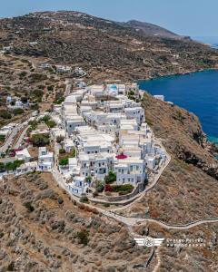 an aerial view of a village on a hill with the ocean at eleni's cozy appartment in Kástron
