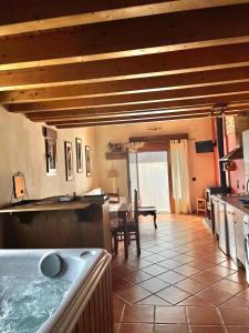 a kitchen with a tub in the middle of a room at El Aravalle, Altillo del Aravalle in Umbrías
