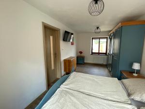 Postel nebo postele na pokoji v ubytování Apartmán u Velké brány